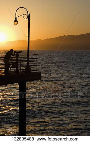 Silhouette of a man at an observation point, Santa Monica, Los Angeles County, California, USA View Large Photo Image Stock Photo - Silhouette of a man at an observation point, Santa Monica, Los Angeles County, California, USA. Fotosearch