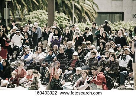 Stock Image - Spectators taking a picture, Union Square, San Francisco, California, USA. Fotosearch