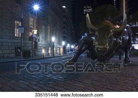 Statue of a charging bull in a street, Wall Street, Manhattan, New York City, New York State, USA View Large Photo Image Stock Photo - Statue of a charging bull in a street, Wall Street, Manhattan, New York City, New York State, USA. Fotosearch