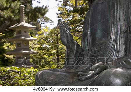 Stock Photo - Statue of Buddha in a park, Japanese Tea Garden, Golden Gate Park, San Francisco, California, USA. Fotosearch