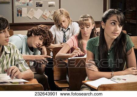Students sitting in a classroom View Large Photo Image Stock Image - Students sitting in a classroom. Fotosearch