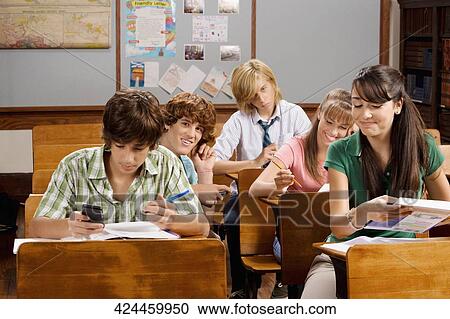 Students sitting in a classroom View Large Photo Image Stock Image - Students sitting in a classroom. Fotosearch