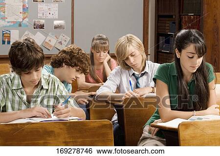 Students studying in a classroom View Large Photo Image Stock Photograph - Students studying in a classroom. Fotosearch