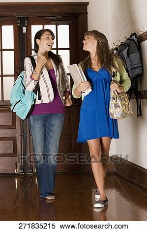 Students walking in a school corridor and gossiping View Large Photo Image Stock Photography - Students walking in a school corridor and gossiping. Fotosearch