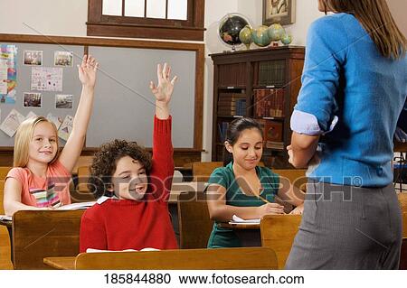 Students with their teacher in a classroom View Large Photo Image Stock Image - Students with their teacher in a classroom . Fotosearch