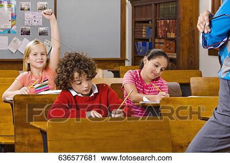 Students with their teacher in a classroom View Large Photo Image Stock Image - Students with their teacher in a classroom . Fotosearch