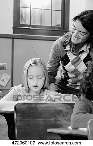 Students with their teacher in a classroom View Large Photo Image Stock Photo - Students with their teacher in a classroom . Fotosearch
