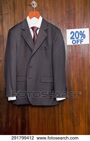 Suit displayed with a Discount sign at a clothing store View Large Photo Image Stock Image - Suit displayed with a Discount sign at a clothing store. Fotosearch