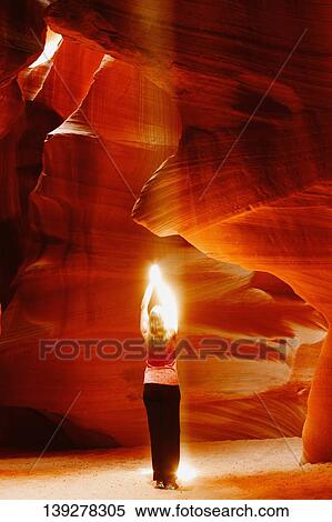 Sunbeam falling on a woman in a canyon, Antelope Canyon, Page, Arizona, USA View Large Photo Image Stock Photography - Sunbeam falling on a woman in a canyon, Antelope Canyon, Page, Arizona, USA. Fotosearch