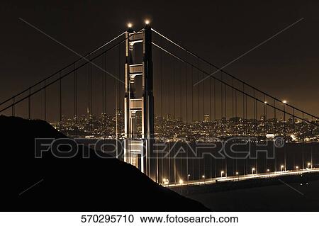 Suspension bridge lit up at night, Golden Gate Bridge, Marin County, San Francisco Bay, San Francisco, California, USA View Large Photo Image Stock Image - Suspension bridge lit up at night, Golden Gate Bridge, Marin County, San Francisco Bay, San Francisco, California, USA. Fotosearch