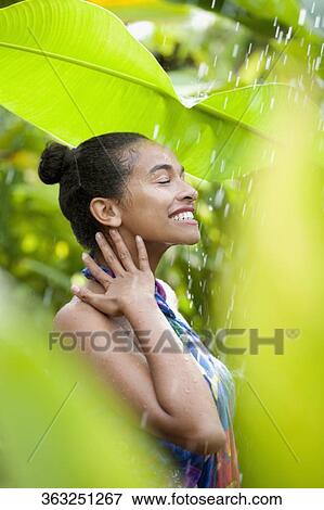 Teenage girl enjoying rain View Large Photo Image Stock Photo - Teenage girl enjoying rain. Fotosearch
