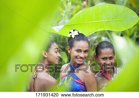 Teenage girl with her friends enjoying rain View Large Photo Image Stock Image - Teenage girl with her friends enjoying rain. Fotosearch