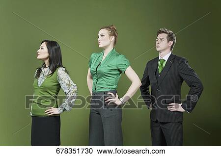 Three business executives standing in a row View Large Photo Image Stock Image - Three business executives standing in a row. Fotosearch