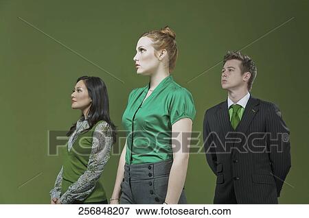 Three business executives standing together View Large Photo Image Stock Photo - Three business executives standing together. Fotosearch