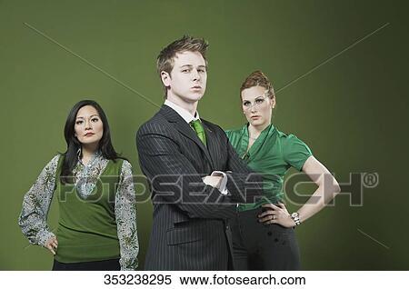 Three business executives standing View Large Photo Image Stock Photography - Three business executives standing. Fotosearch
