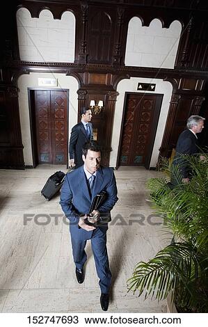 Three businessmen walking in a hotel lobby, Biltmore Hotel, Coral Gables, Florida, USA View Large Photo Image Stock Image - Three businessmen walking in a hotel lobby, Biltmore Hotel, Coral Gables, Florida, USA. Fotosearch