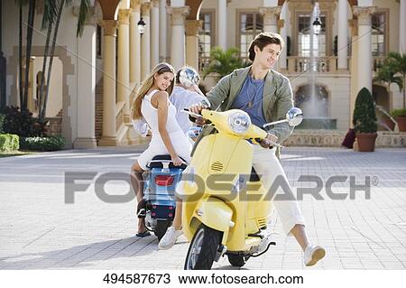 Three friends having fun on mopeds, Biltmore Hotel, Coral Gables, Florida, USA View Large Photo Image Stock Image - Three friends having fun on mopeds, Biltmore Hotel, Coral Gables, Florida, USA. Fotosearch