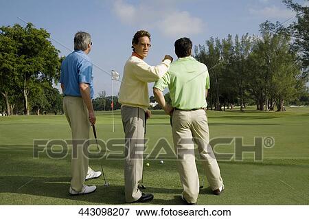 Three golfer standing in a golf course, Biltmore Golf Course, Coral Gables, Florida, USA View Large Photo Image Stock Photo - Three golfer standing in a golf course, Biltmore Golf Course, Coral Gables, Florida, USA. Fotosearch