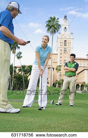 Three golfer standing in a golf course, Biltmore Golf Course, Biltmore Hotel, Coral Gables, Florida, USA View Large Photo Image Stock Photograph - Three golfer standing in a golf course, Biltmore Golf Course, Biltmore Hotel, Coral Gables, Florida, USA. Fotosearch