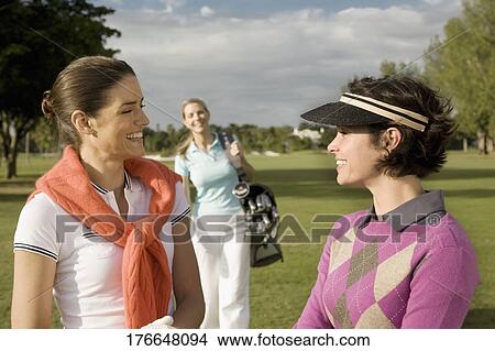 Three golfers in a golf course and smiling, Biltmore Golf Course, Coral Gables, Florida, USA View Large Photo Image Picture - Three golfers in a golf course and smiling, Biltmore Golf Course, Coral Gables, Florida, USA. Fotosearch