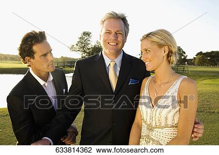 Stock Image - Three golfers in a golf course, Biltmore Golf Course, Coral Gables, Florida, USA. Fotosearch