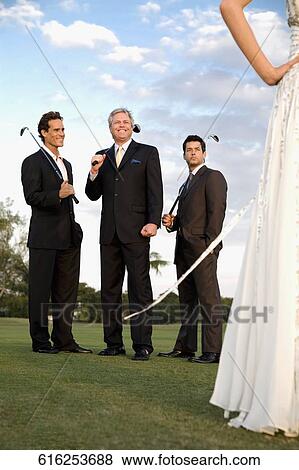 Three golfers looking at a bride in a golf course, Biltmore Golf Course, Coral Gables, Florida, USA View Large Photo Image Stock Photo - Three golfers looking at a bride in a golf course, Biltmore Golf Course, Coral Gables, Florida, USA. Fotosearch
