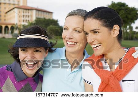 Stock Photo - Three golfers smiling, Biltmore Golf Course, Biltmore Hotel, Coral Gables, Florida, USA. Fotosearch
