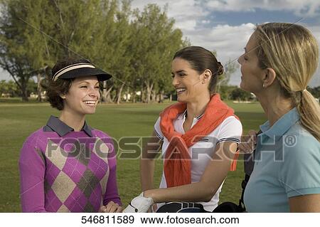 Three golfers standing in a golf course and smiling, Biltmore Golf Course, Coral Gables, Florida, USA View Large Photo Image Stock Photo - Three golfers standing in a golf course and smiling, Biltmore Golf Course, Coral Gables, Florida, USA. Fotosearch