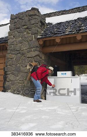 Tourist at the entrance of a hotel, Old faithful, Yellowstone National Park, Wyoming, USA View Large Photo Image Stock Photograph - Tourist at the entrance of a hotel, Old faithful, Yellowstone National Park, Wyoming, USA. Fotosearch