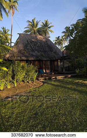 Tourist resort surrounded by palm trees View Large Photo Image Stock Image - Tourist resort surrounded by palm trees. Fotosearch