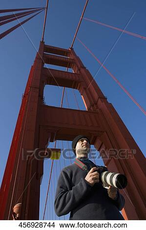 Tourist standing on the bridge, Golden Gate Bridge, San Francisco Bay, San Francisco, California, USA View Large Photo Image Picture - Tourist standing on the bridge, Golden Gate Bridge, San Francisco Bay, San Francisco, California, USA. Fotosearch