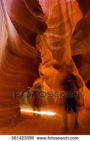 Stock Photo - Tourists walking in a canyon, Antelope Canyon, Page, Arizona, USA. Fotosearch