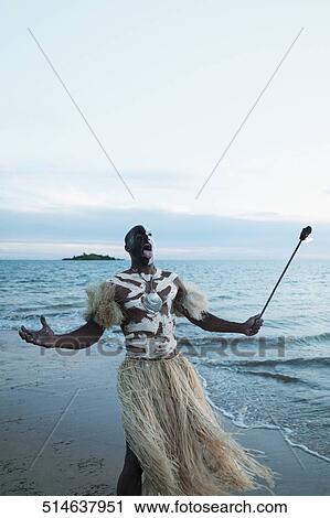 Stock Image - Tribesman looking angry on the beach. Fotosearch