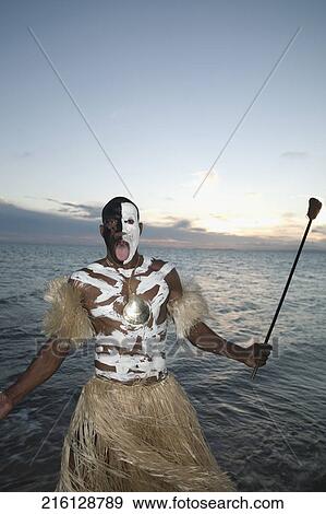 Tribesman looking angry on the beach View Large Photo Image Stock Photo - Tribesman looking angry on the beach. Fotosearch