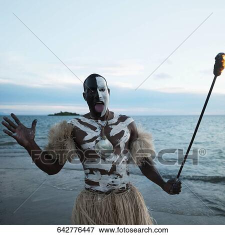 Tribesman looking angry on the beach View Large Photo Image Stock Photo - Tribesman looking angry on the beach. Fotosearch