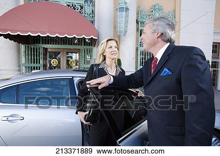 Two business executives looking at each other and smiling, Biltmore Hotel, Coral Gables, Florida, USA View Large Photo Image Stock Photo - Two business executives looking at each other and smiling, Biltmore Hotel, Coral Gables, Florida, USA. Fotosearch