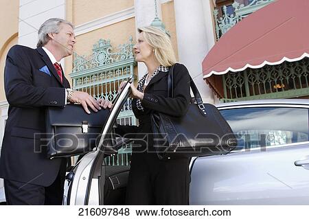 Two business executives looking at each other and smiling, Biltmore Hotel, Coral Gables, Florida, USA View Large Photo Image Stock Photo - Two business executives looking at each other and smiling, Biltmore Hotel, Coral Gables, Florida, USA. Fotosearch