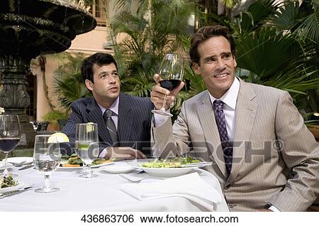 Two businessmen having lunch in a hotel, Biltmore Hotel, Coral Gables, Florida, USA View Large Photo Image Stock Photograph - Two businessmen having lunch in a hotel, Biltmore Hotel, Coral Gables, Florida, USA. Fotosearch