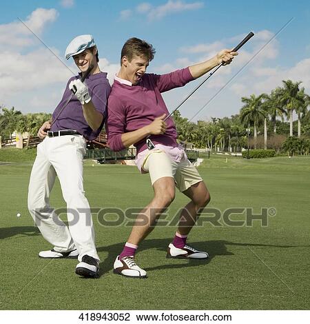 Two friends having fun in a golf course, Biltmore Golf Course, Coral Gables, Florida, USA View Large Photo Image Stock Image - Two friends having fun in a golf course, Biltmore Golf Course, Coral Gables, Florida, USA. Fotosearch
