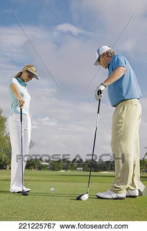 Two golfer standing in a golf course, Biltmore Golf Course, Coral Gables, Florida, USA View Large Photo Image Stock Photo - Two golfer standing in a golf course, Biltmore Golf Course, Coral Gables, Florida, USA. Fotosearch