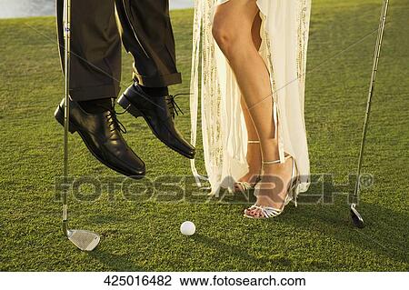Two golfers playing golf in a golf course, Biltmore Golf Course, Coral Gables, Florida, USA View Large Photo Image Stock Image - Two golfers playing golf in a golf course, Biltmore Golf Course, Coral Gables, Florida, USA. Fotosearch