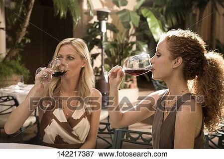 Two women enjoying drinks, Biltmore Hotel, Coral Gables, Florida, USA View Large Photo Image Stock Photo - Two women enjoying drinks, Biltmore Hotel, Coral Gables, Florida, USA. Fotosearch