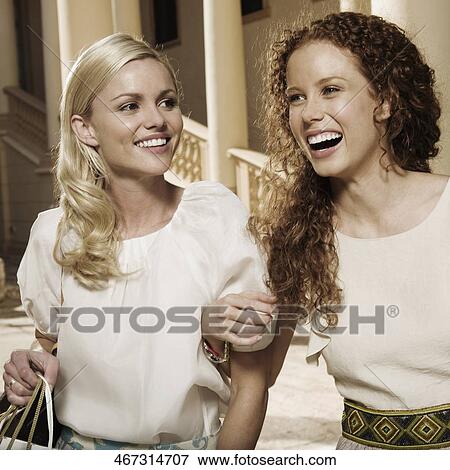 Two women holding shopping bags and smiling, Biltmore Hotel, Coral Gables, Florida, USA View Large Photo Image Stock Photo - Two women holding shopping bags and smiling, Biltmore Hotel, Coral Gables, Florida, USA. Fotosearch