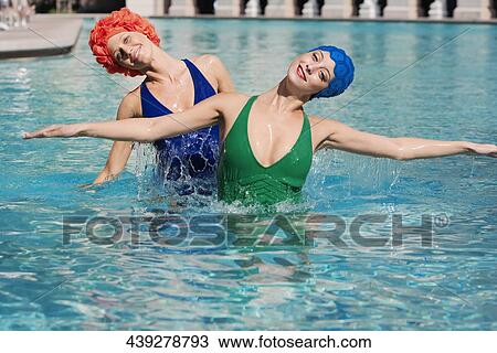 Stock Image - Two women in a swimming pool, Biltmore Hotel, Coral Gables, Florida, USA. Fotosearch