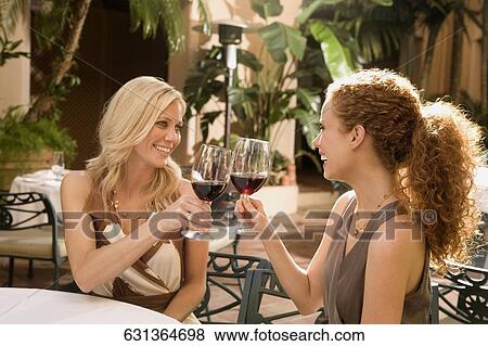 Two women toasting with drinks in a hotel, Biltmore Hotel, Coral Gables, Florida, USA View Large Photo Image Stock Photo - Two women toasting with drinks in a hotel, Biltmore Hotel, Coral Gables, Florida, USA. Fotosearch