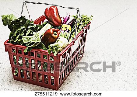 Stock Photo - Vegetables in a shopping basket. Fotosearch