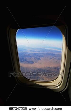 View of a landscape from the airplane window View Large Photo Image Stock Photography - View of a landscape from the airplane window. Fotosearch