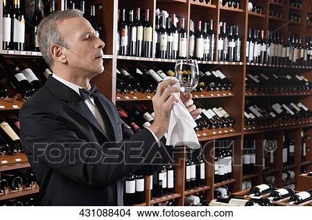 Waiter polishing a wine glass View Large Photo Image Picture - Waiter polishing a wine glass. Fotosearch