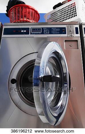 Washing machine in a laundromat View Large Photo Image Stock Image - Washing machine in a laundromat. Fotosearch