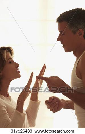 Woman arguing with a man in the bedroom View Large Photo Image Stock Image - Woman arguing with a man in the bedroom. Fotosearch